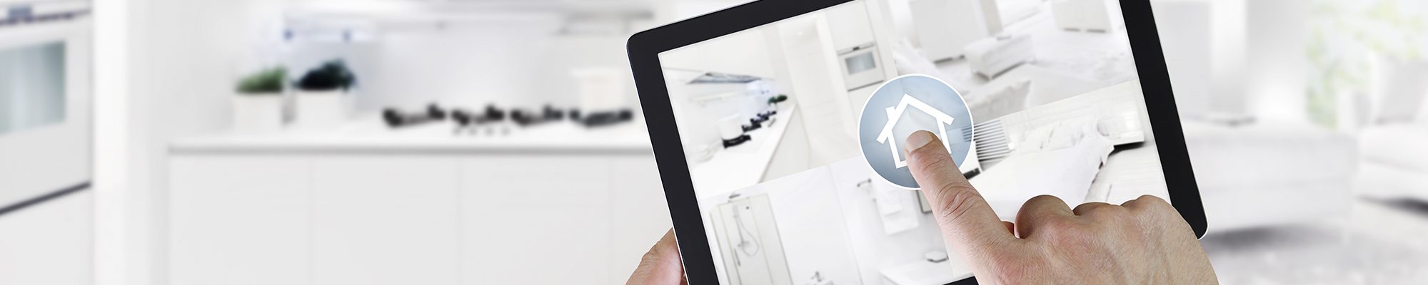 smart home control concept hand touch digital tablet screen with interiors, living room, kitchen, bedroom and  bathroom on blurred kitchen background, web banner and copy space template